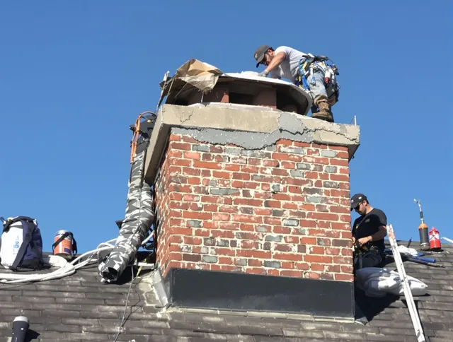 Brunswick Chimney Sweep installing a custom chimney crown in Brunswick, OH