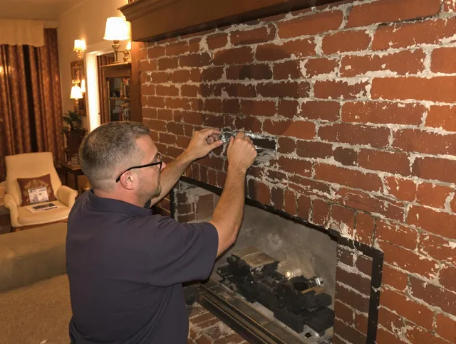 Brunswick Chimney Sweep expert fixing a fireplace in Brunswick, OH